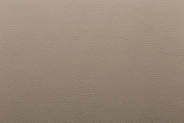 Dark beige artificial leather. Texture for background and design.