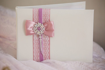 white closed wish book for the newlyweds at the wedding