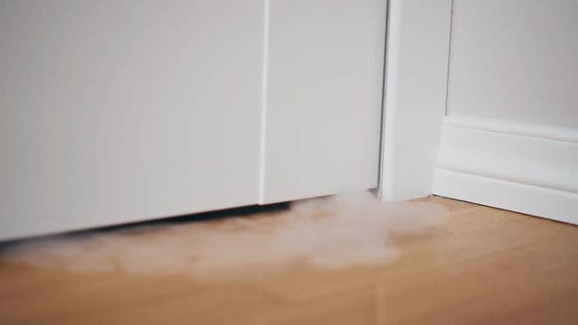 Smoke coming under the door. Fire in the house.
