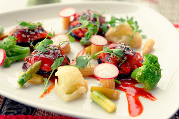 Light summer starter on plate, toned