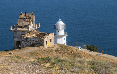 Fototapeta na wymiar Crimea, summer, Cape Megan, lighthouse, view from the top, coastline, blue sky, clouds