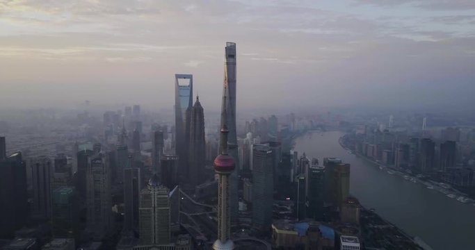 Aerial shot of Shanghai city skyline during a gloomy sunrise