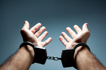 man hand handcuffs