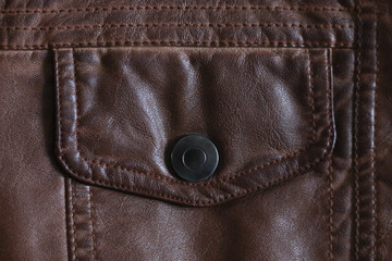 button pocket on old worn leather jacket