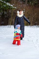 family walk in the winter forest dad mom and child