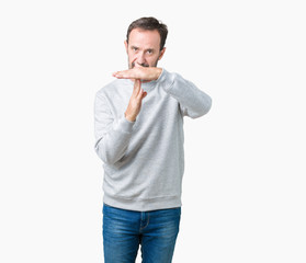 Handsome middle age senior man wearing a sweatshirt over isolated background Doing time out gesture...
