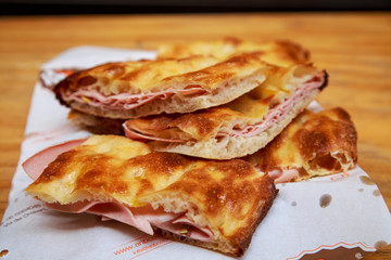 Eating pizza and mortadella in Rome