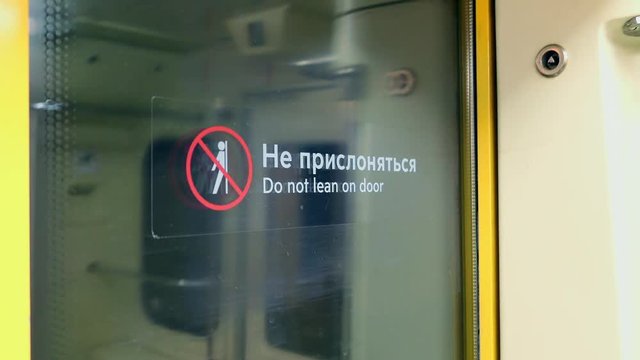 Sign Do Not Lean On Door Of The Subway Car In Moscow