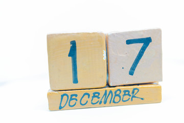 December 17th. Day 17 of month, calendar on wooden background. Handmade calendar
