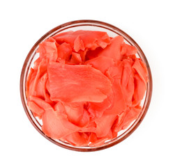 Pickled ginger leaves in a glass plate on a white. The view from the top.