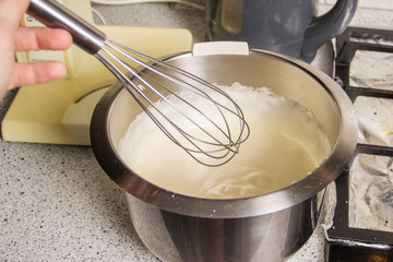 The process of kneading dough in an iron bowl