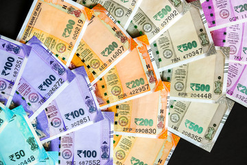 Close up view of brand new indian 50, 100, 200, 500, 2000 rupees banknotes.