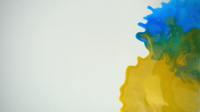 Paint splashes in slow motion. Copy space in minimal concept.