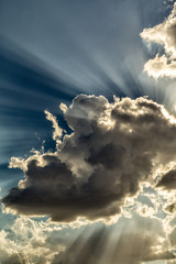 Glowing clouds with sun rays from behind