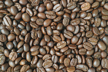 Top view of dark brown aromatic roasted coffee beans for background or banner 