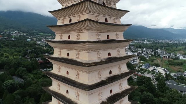 Circling around stunning tower of the famous Three Pagodas, with the beautiful Chongsheng monastery as backdrop, in Dali, China