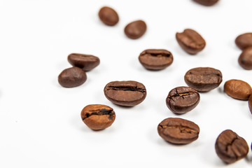 Roasted coffee beans isolated on white background, angle view