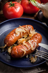 Fried sausage with onions.