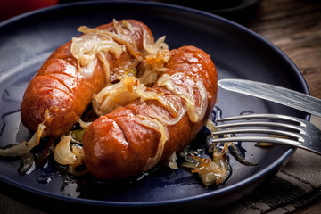 Fried sausage with onions.