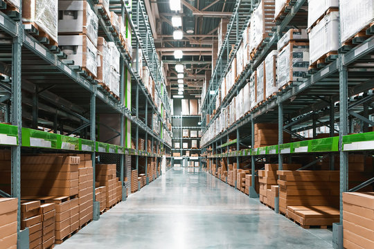 Rows Of Shelves With Boxes In Warehouse