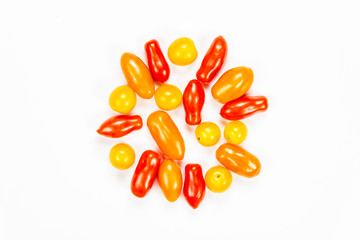 Centered composition of cherry tomatoes, on white background