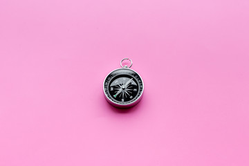 Direction of movement. Compass on pink background top view copy space