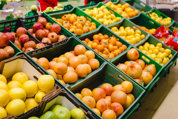 shelves with variety testy vitamin products in fruit and vegetables department in the supermarket.