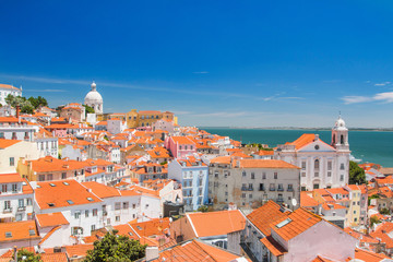 Fototapeta premium Portugal, Lisbon, aerial scenic view of central Lisbon Portugal with red tile roofs of the old city