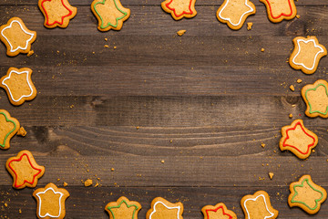 Christmas gingerbread cookies with frosting isolated on wooden background