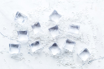 Obraz premium pile of ice cubes on marble bar table top view