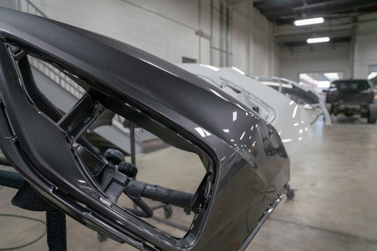 Car bumpers painted in auto body shop