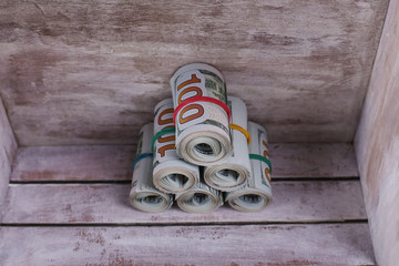 Close-up rolled American dollars banknotes