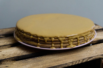 Homemade cake on a wooden background
