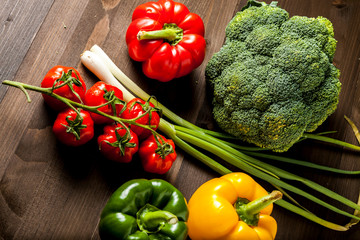 Colorful fresh vegetables isolated on a dark wooden table