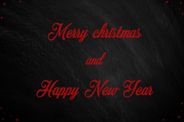 Fototapeta na wymiar Blackboard with the message merry christmas anda happy new year