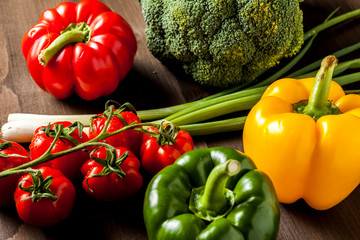 Colorful fresh vegetables isolated on a dark wooden table