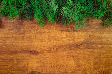 spruce branches on wooden table