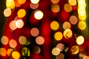 Christmas home room with tree and festive bokeh lighting, blurred holiday background