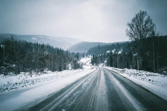 winter road in mountains. overcast.