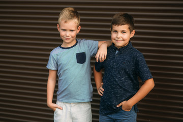 Two stylish childrend posing to the photograher. Young model