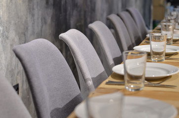 Neatly decorated table for celebration in grey colors. Selective focus.