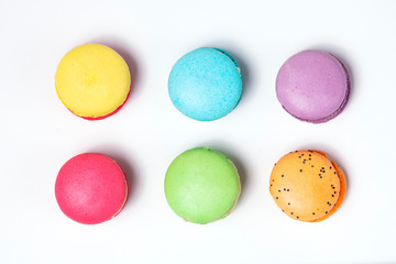 Sweet and colourful french macaroons on white background.