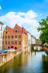 Beautiful canal and traditional houses in the old town of Bruges (Brugge), Belgium