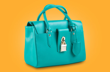 fashionable turquoise women bag on a yellow punchy background
