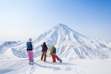 skiers in mountains