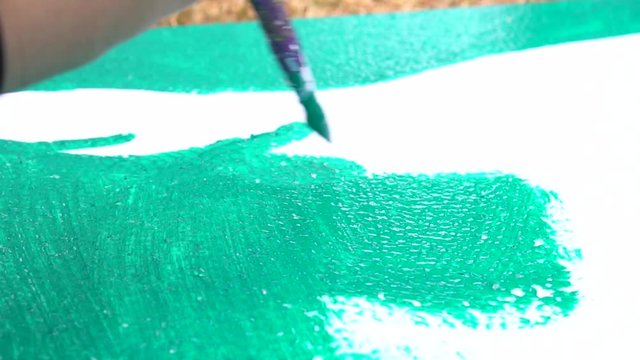 Artist painting watercolor abstract of landscape with brush drawing on paper for creation at studio for relax and hobby. Creative skill Hobbies concept