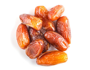 Pile of dried dates isolated on white background.