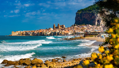 Panoramic view of Cefalu city with traditional houses on the seaside in a sunny day on Sicily islands - obrazy, fototapety, plakaty