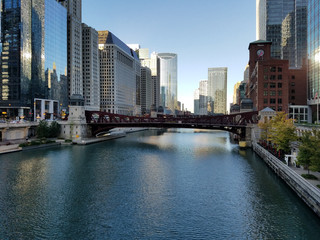 Fototapeta na wymiar Chicago, Illinois 10-08-2016 View of the Chicago River, its bridges and surrounding buildings on a clear fall morning.