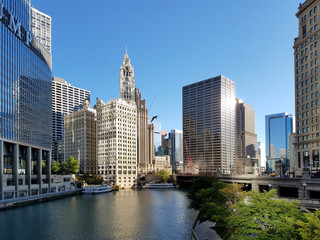Fototapeta na wymiar Chicago, Illinois 10-08-2016 View of the Chicago River, its bridges and surrounding buildings on a clear fall morning.